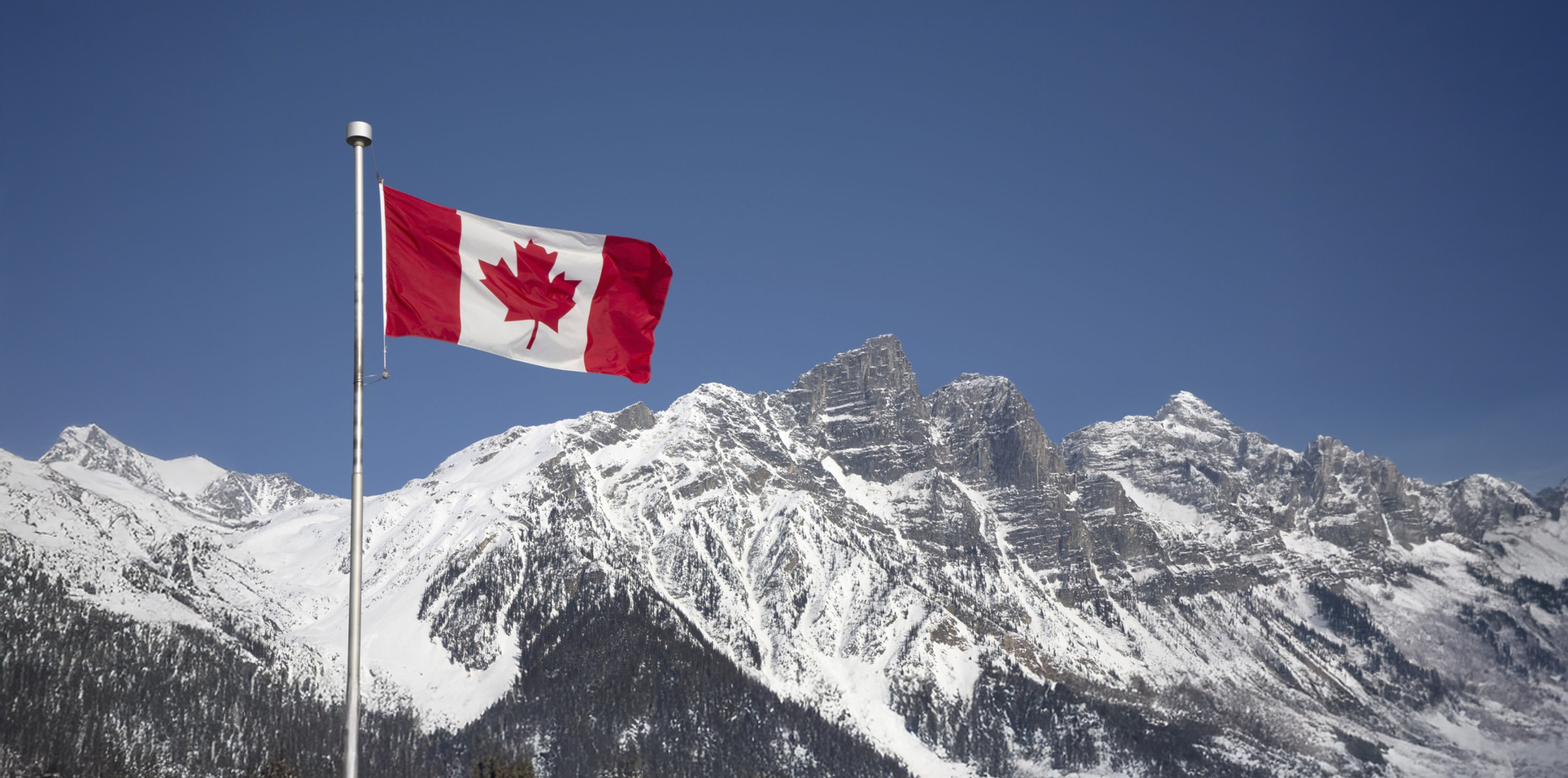 The Canadian flag against the Rocky Mountains, from the original Enable Benefits website